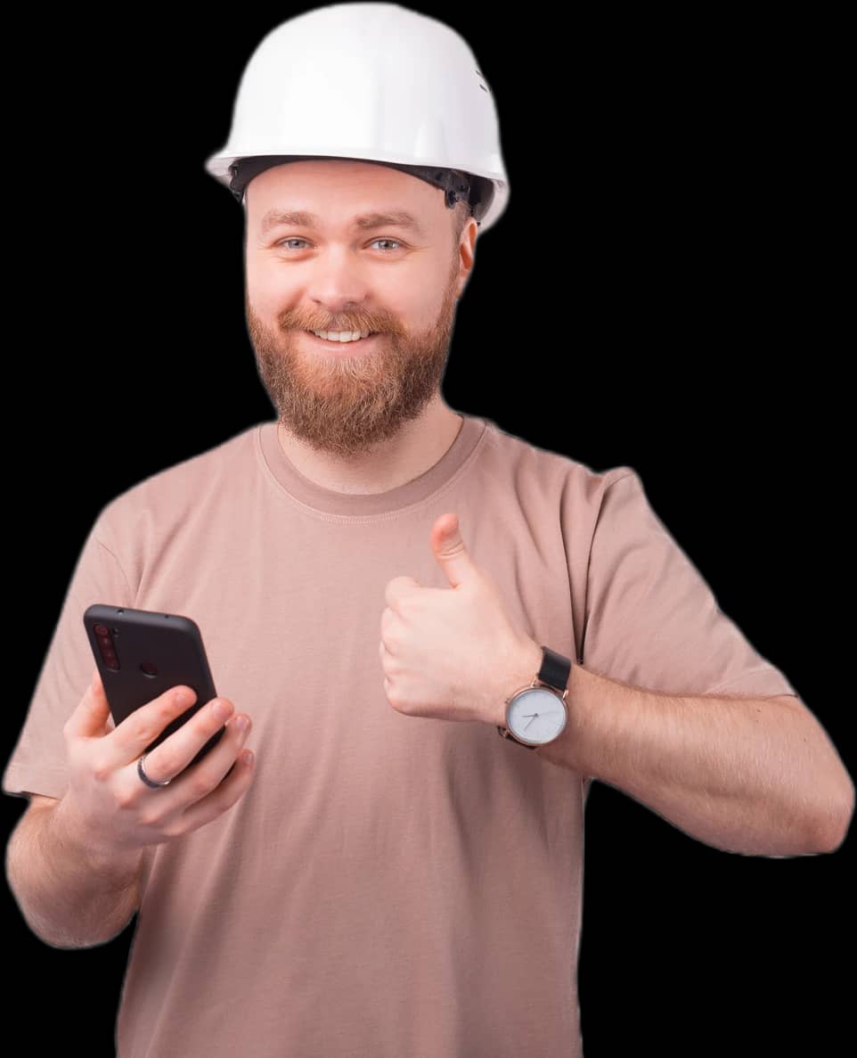 Smiling home services contractor in a white hard hat giving a thumbs up while holding a smartphone